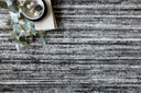 Hand-loomed Loloi Brandt rug in calming neutral tones with elegant tonal stripes, subtle sheen, and Good Weave certification for ethical craftsmanship.