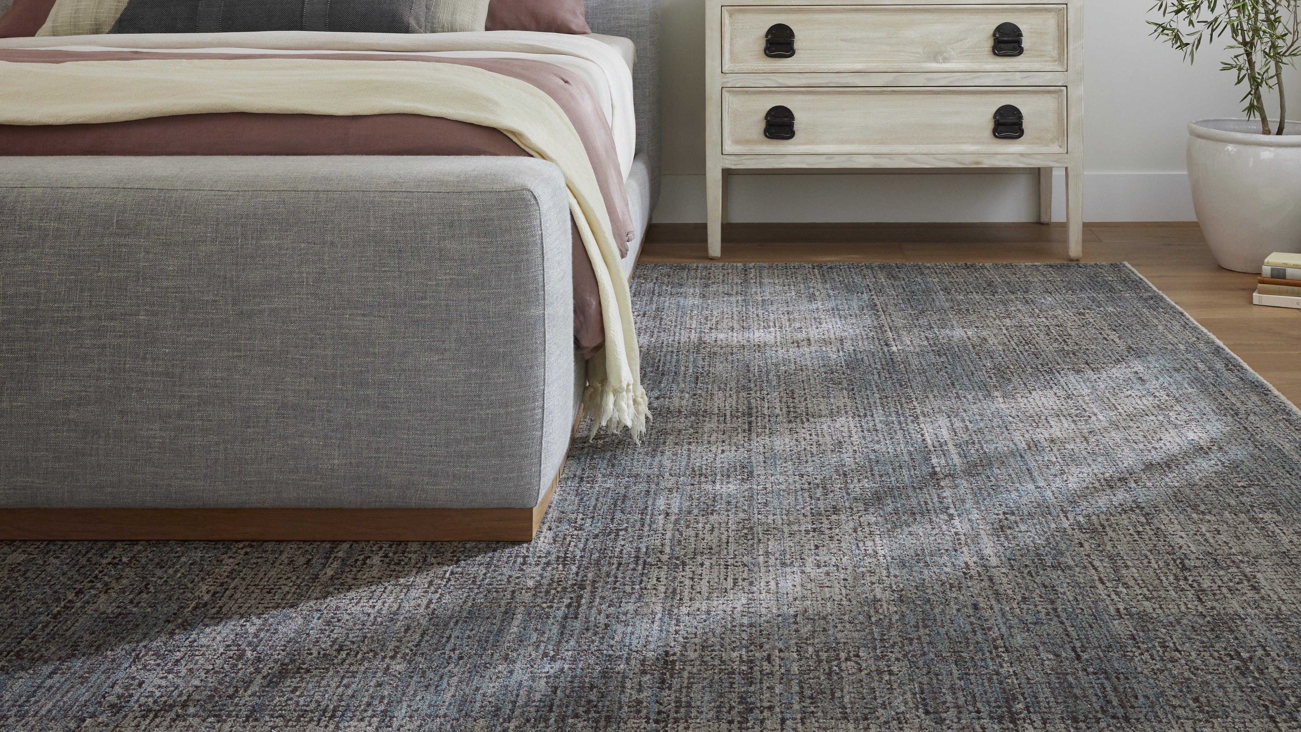 The Angela Rose x Loloi area rug collection features traditional, vintage, and modern geometric designs made from durable polyester, jute, and cotton.
