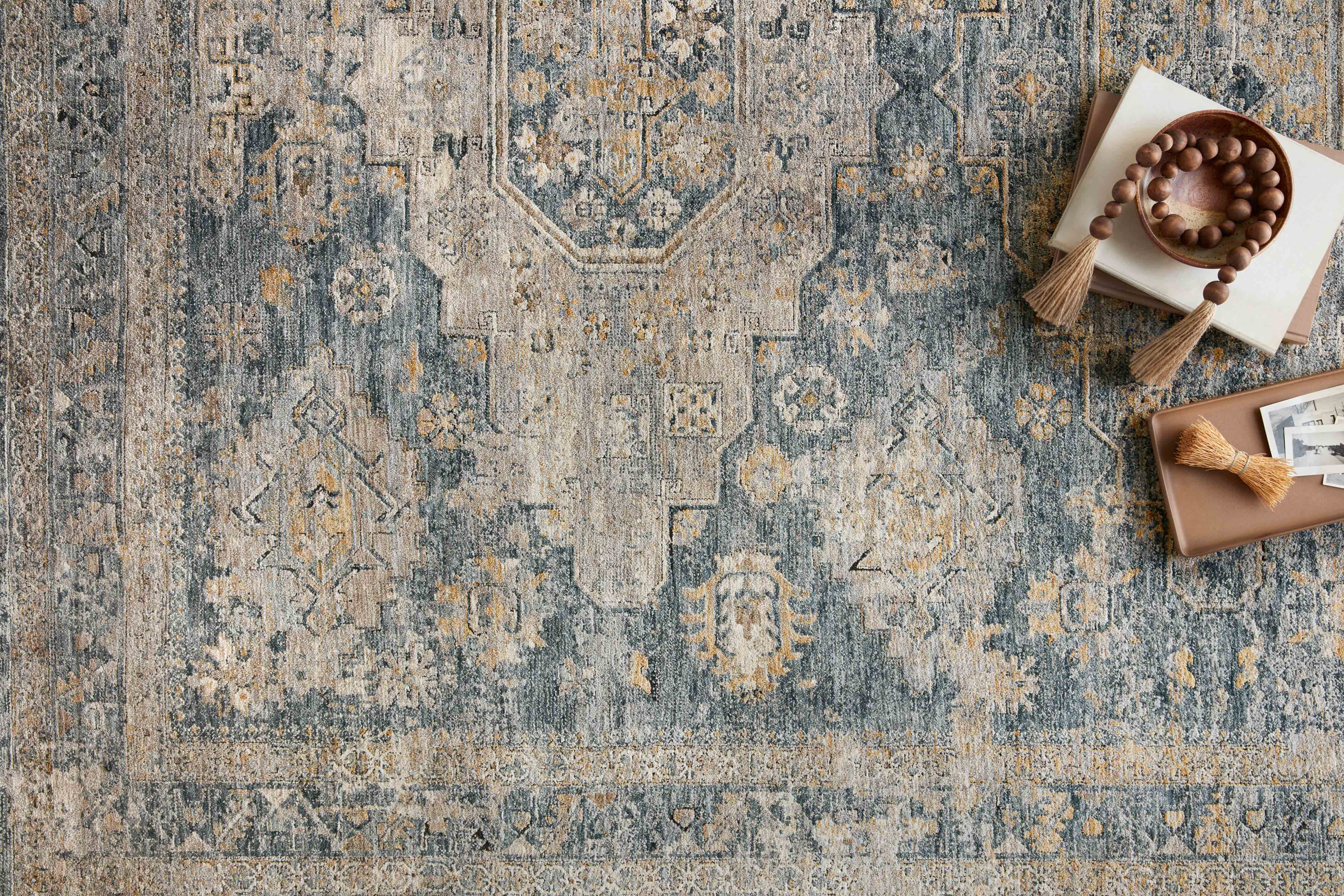Loloi Gaia Collection rug with a vibrant mix of abstract and traditional patterns in warm and cool colors, power-loomed from 100% polyester pile in Turkey.