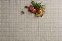Eco-friendly Loloi Hadley Collection rug in muted colors, hand-knotted in India, with unique cut pile and looped texture.