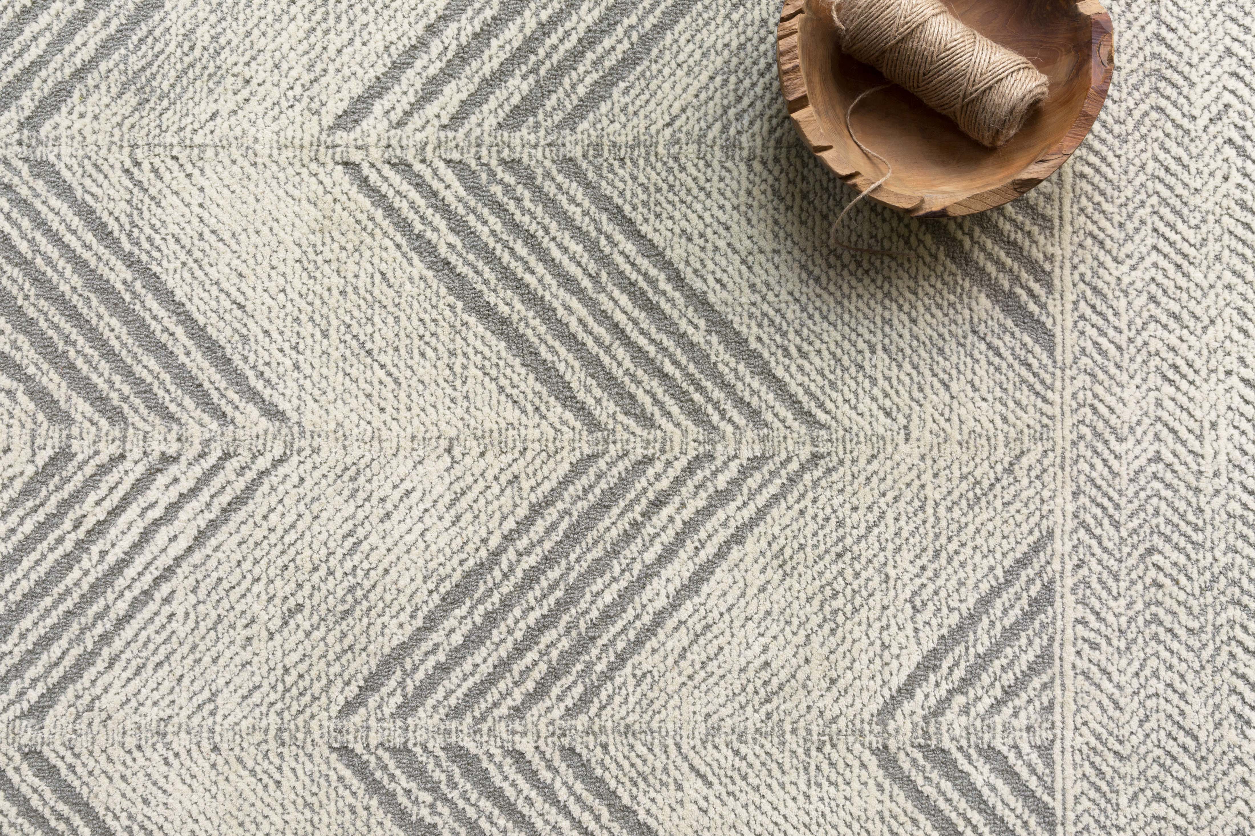 Elegant 100% wool rug from the Kopa Collection, showcasing intricate linear patterns in a low-profile design, hand-tufted by skilled artisans in India.