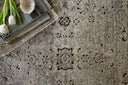 Millennium Collection area rug with updated traditional motifs in trending colors, featuring a dimensional distressed pattern and a lustrous, durable pile.