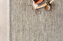 Hand-woven Loloi Omen Collection area rug in India, featuring elegant chevron waves in natural jute, wool, and cotton, GoodWeave certified for ethical craftsmanship.