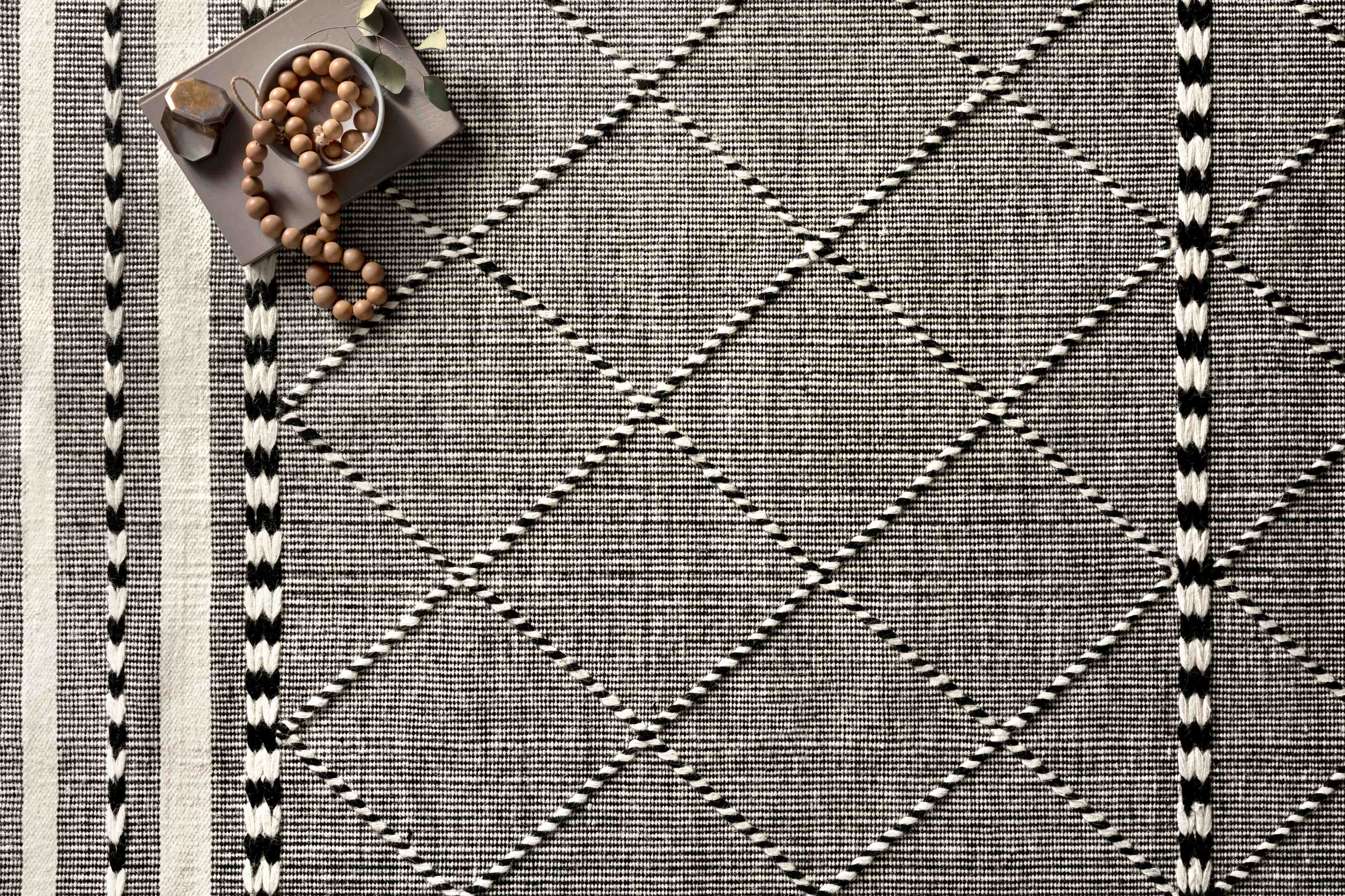 Loloi Sawyer Collection hand‑loomed wool and cotton rug with bold graphic design and decorative fringe.