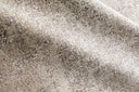 Power-loomed Loloi Sienne Collection rug featuring a tonal, subtly distressed design with a soft, slightly shiny pile.