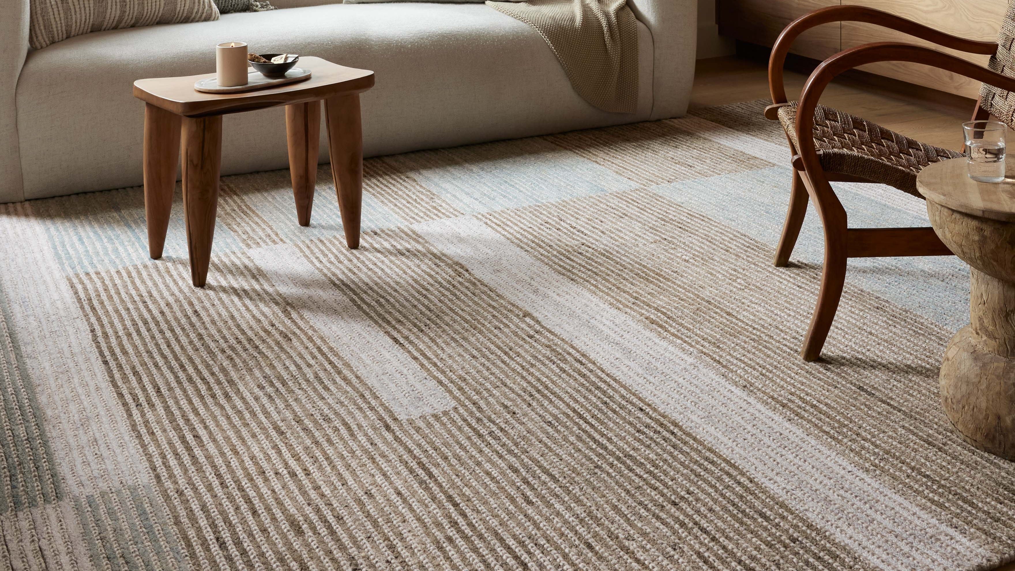 The Loloi Stiles Collection is a uniquely crafted area rug that combines cut pile and braided yarns that run in ribbed lines across the rug’s expanse, revealing a modern color block pattern.
