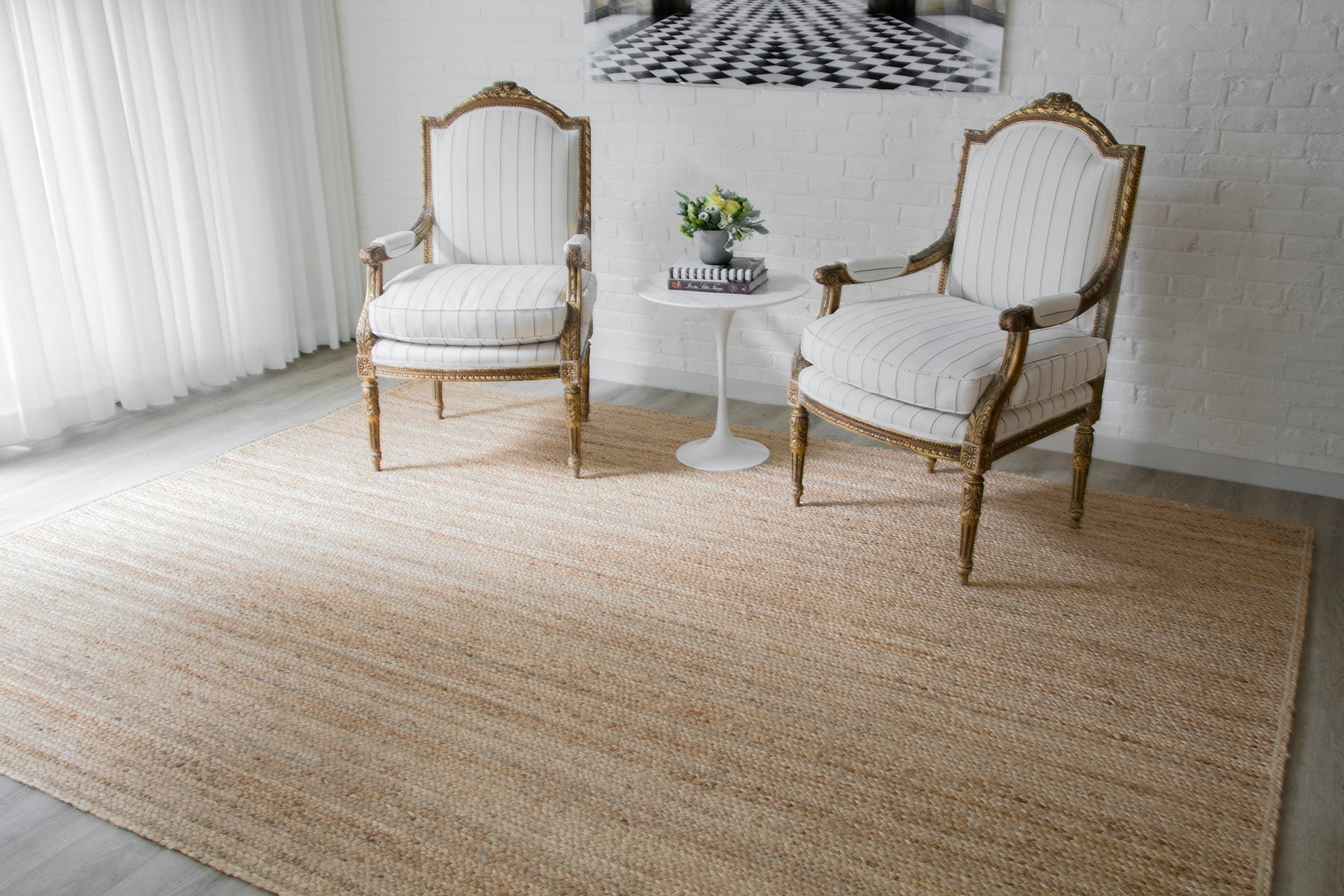 Erin Gates by Momeni Westshore Rug Collection: natural jute braided rug with subtle brown variation in a bright living room.