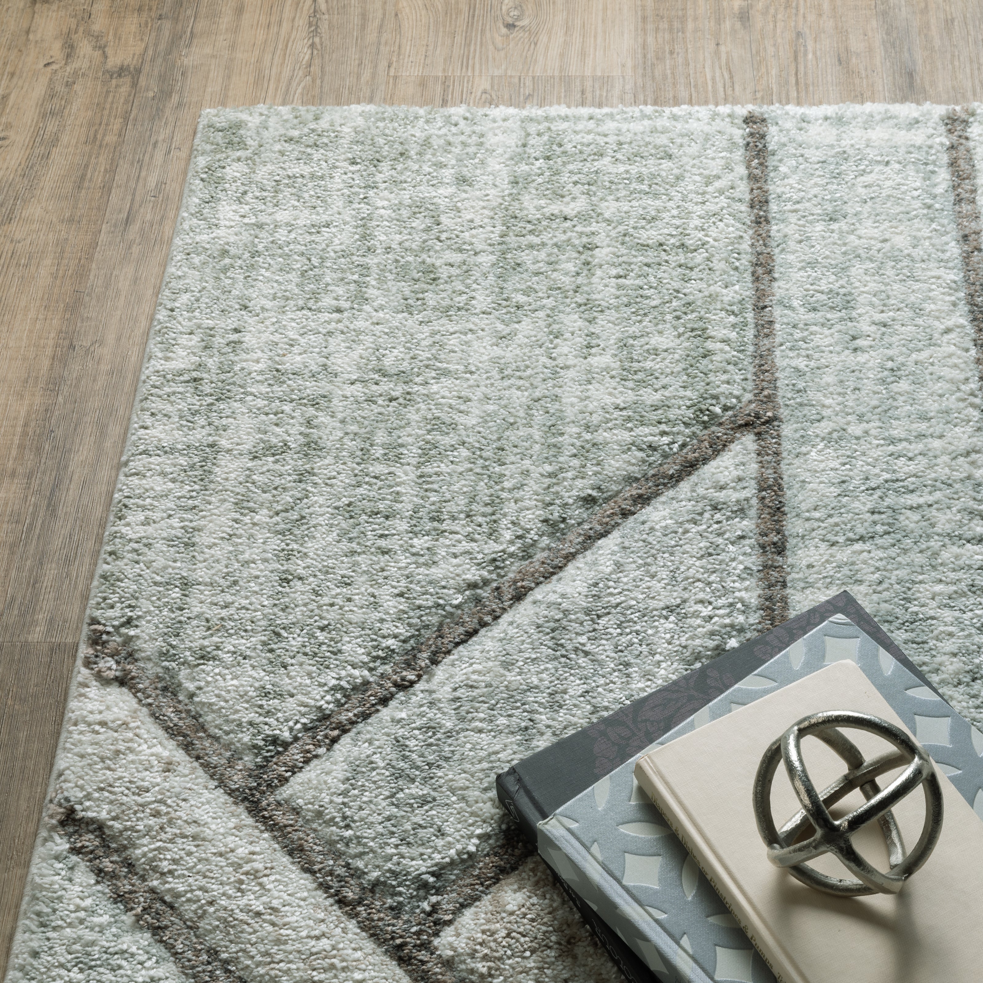 Oriental Weavers rug collection features a dense, high-pile design, meticulously crafted from ultra-soft polypropylene for enhanced visual and tactile appeal.
