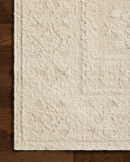 A stunning hand-woven wool area rug, the Alara ALR-01 Ivory / Natural Area Rug features refined ivory and warm natural tones for a polished look