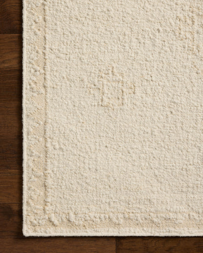 The Alara ALR-02 Ivory / Natural Area Rug delivers refined ivory and warm natural beauty in a hand-woven wool area rug
