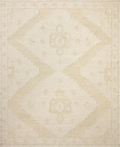 Designed in refined ivory and warm natural hues, the Alara ALR-03 Ivory / Natural Area Rug is a hand-woven wool area rug that stands out