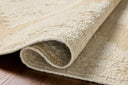 Designed in refined ivory and warm natural hues, the Alara ALR-03 Ivory / Natural Area Rug is a hand-woven wool area rug that stands out