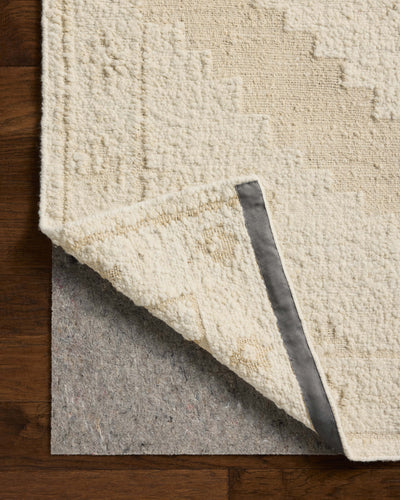 Designed in refined ivory and warm natural hues, the Alara ALR-03 Ivory / Natural Area Rug is a hand-woven wool area rug that stands out