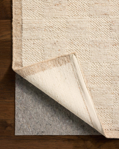 Rich in warm natural hues, the Alina ALN-01 Natural Area Rug is a hand-woven wool area rug built for style and comfort