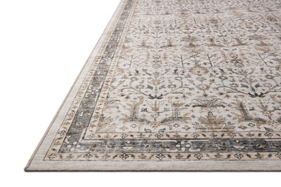 A power-loomed polyester area rug in refined ivory and grounding stone tones with traditional and distressed motifs, the Anniston ANS-01 Ivory / Stone Area Rug grounds your room beautifully