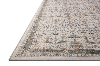 A power-loomed polyester area rug in refined ivory and grounding stone tones with traditional and distressed motifs, the Anniston ANS-01 Ivory / Stone Area Rug grounds your room beautifully