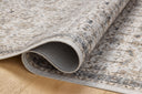 A power-loomed polyester area rug in refined ivory and grounding stone tones with traditional and distressed motifs, the Anniston ANS-01 Ivory / Stone Area Rug grounds your room beautifully