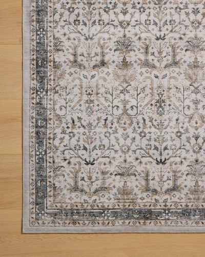 A power-loomed polyester area rug in refined ivory and grounding stone tones with traditional and distressed motifs, the Anniston ANS-01 Ivory / Stone Area Rug grounds your room beautifully