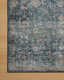 The Anniston ANS-02 Lagoon / Natural Area Rug is a power-loomed polyester area rug that radiates tranquil lagoon and warm natural charm and traditional and distressed elegance
