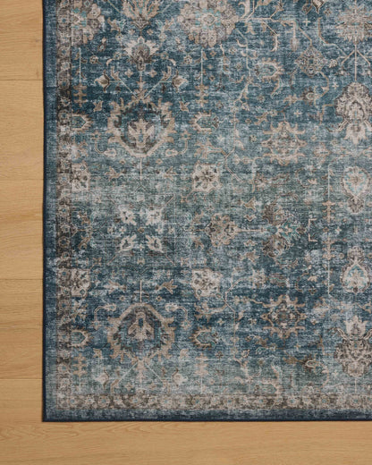 The Anniston ANS-02 Lagoon / Natural Area Rug is a power-loomed polyester area rug that radiates tranquil lagoon and warm natural charm and traditional and distressed elegance