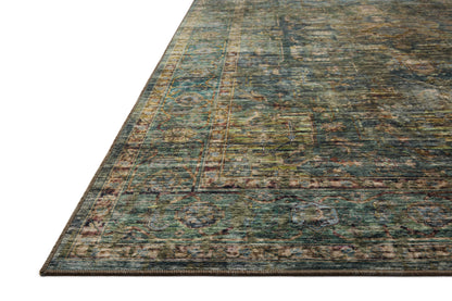 Featuring tranquil lagoon and vibrant multi-toned hues and traditional and distressed detail, the Anniston ANS-05 Lagoon / Multi Area Rug is a power-loomed polyester area rug for any room
