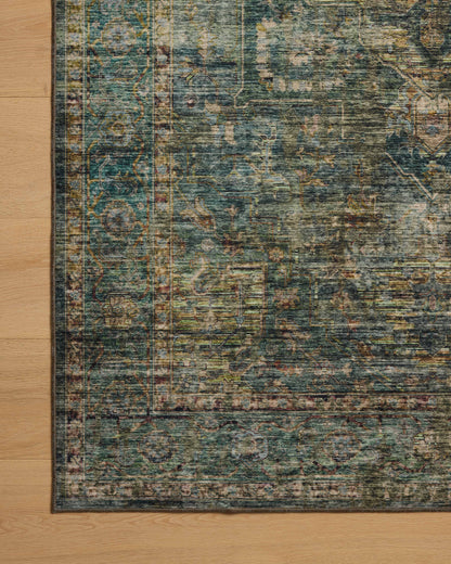 Featuring tranquil lagoon and vibrant multi-toned hues and traditional and distressed detail, the Anniston ANS-05 Lagoon / Multi Area Rug is a power-loomed polyester area rug for any room