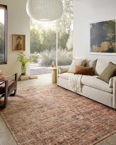 A power-loomed polyester area rug with traditional and distressed flair in earthy clay and deep charcoal tones, the Anniston ANS-06 Clay / Charcoal Area Rug anchors any room
