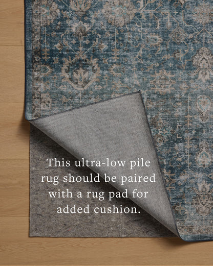 The Anniston ANS-02 Lagoon / Natural Area Rug is a power-loomed polyester area rug that radiates tranquil lagoon and warm natural charm and traditional and distressed elegance