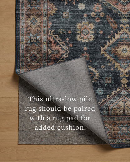 Layered in casual denim and glowing sunset hues with traditional and distressed patterns, the Anniston ANS-03 Denim / Sunset Area Rug is a power-loomed polyester area rug perfect for any setting