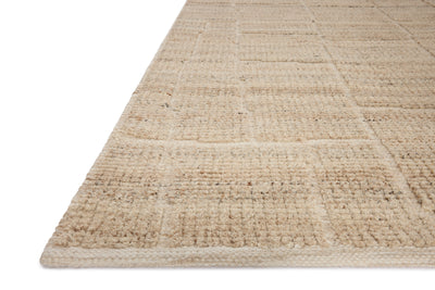 A hand-loomed wool and cotton area rug with contemporary flair in warm natural tones, the Asha ASA-01 Natural Area Rug anchors any room