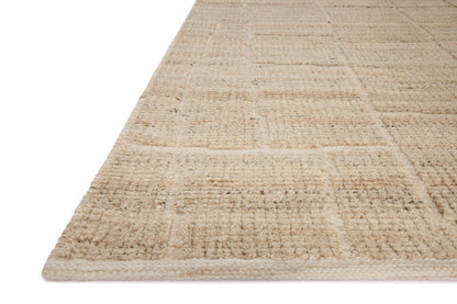 A hand-loomed wool and cotton area rug with contemporary flair in warm natural tones, the Asha ASA-01 Natural Area Rug anchors any room