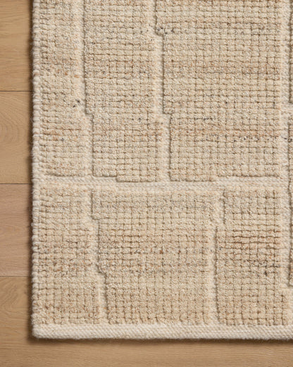 A hand-loomed wool and cotton area rug with contemporary flair in warm natural tones, the Asha ASA-01 Natural Area Rug anchors any room