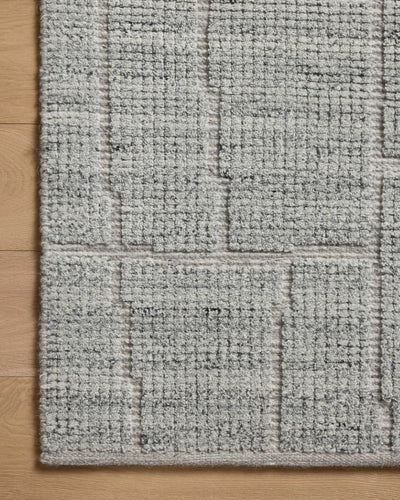 The Asha ASA-01 Sky Area Rug pairs breezy sky-blue tones and contemporary patterns in a hand-loomed wool and cotton area rug