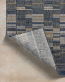 A power-loomed polypropylene area rug with contemporary and linear design in casual denim and radiant gold hues, the Birch BIR-04 Denim / Gold Area Rug is a standout in any décor