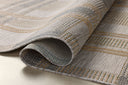 The Birch BIR-05 Bone / Gold Area Rug highlights bone and radiant gold tones and contemporary and linear texture in a beautifully made power-loomed polypropylene area rug