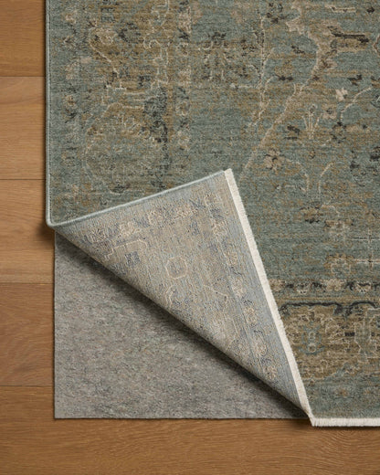 A power-loomed polyester area rug with contemporary and traditional design in aqua and earthy olive hues, the Briar BRR-02 Aqua / Olive Area Rug is a standout in any décor