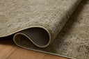 Dressed in earthy olive and grounding stone hues with contemporary and traditional detail, the Briar BRR-02 Olive / Stone Area Rug is a power-loomed polyester area rug that completes any room