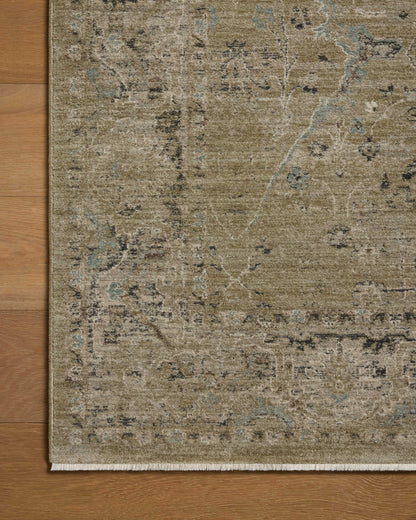 Dressed in earthy olive and grounding stone hues with contemporary and traditional detail, the Briar BRR-02 Olive / Stone Area Rug is a power-loomed polyester area rug that completes any room