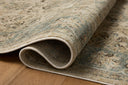 The Briar BRR-05 Ant. Ivory / Blue Area Rug is a power-loomed polyester area rug that radiates ant. ivory and calming blue charm and contemporary and traditional elegance