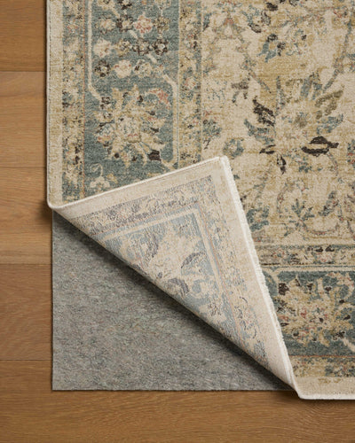 The Briar BRR-05 Ant. Ivory / Blue Area Rug is a power-loomed polyester area rug that radiates ant. ivory and calming blue charm and contemporary and traditional elegance