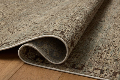 Featuring soft misty and striking granite hues and contemporary and traditional detail, the Briar BRR-06 Mist / Granite Area Rug is a power-loomed polyester area rug for any room