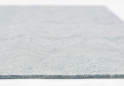 Close-up side view of the Charles CHR-1 Blue Area Rug showing its wool texture and chevron pattern.
