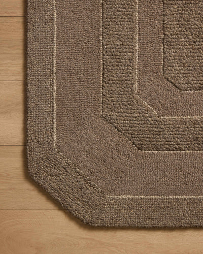 The Clayton CLN-01 Bark Area Rug transforms any space with grounded bark tones and traditional design in a hand-tufted wool area rug