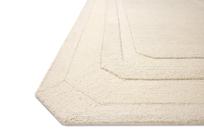 A hand-tufted wool area rug in refined ivory tones with traditional motifs, the Clayton CLN-01 Ivory Area Rug grounds your room beautifully