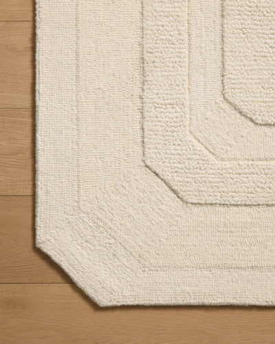 A hand-tufted wool area rug in refined ivory tones with traditional motifs, the Clayton CLN-01 Ivory Area Rug grounds your room beautifully