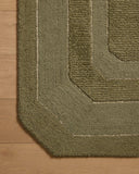 The Clayton CLN-01 Olive Area Rug is a hand-tufted wool area rug that radiates earthy olive charm and traditional elegance