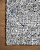 The Cline CLI-01 Sky Area Rug blends breezy sky-blue tones into a hand-woven 100% wool area rug with timeless appeal