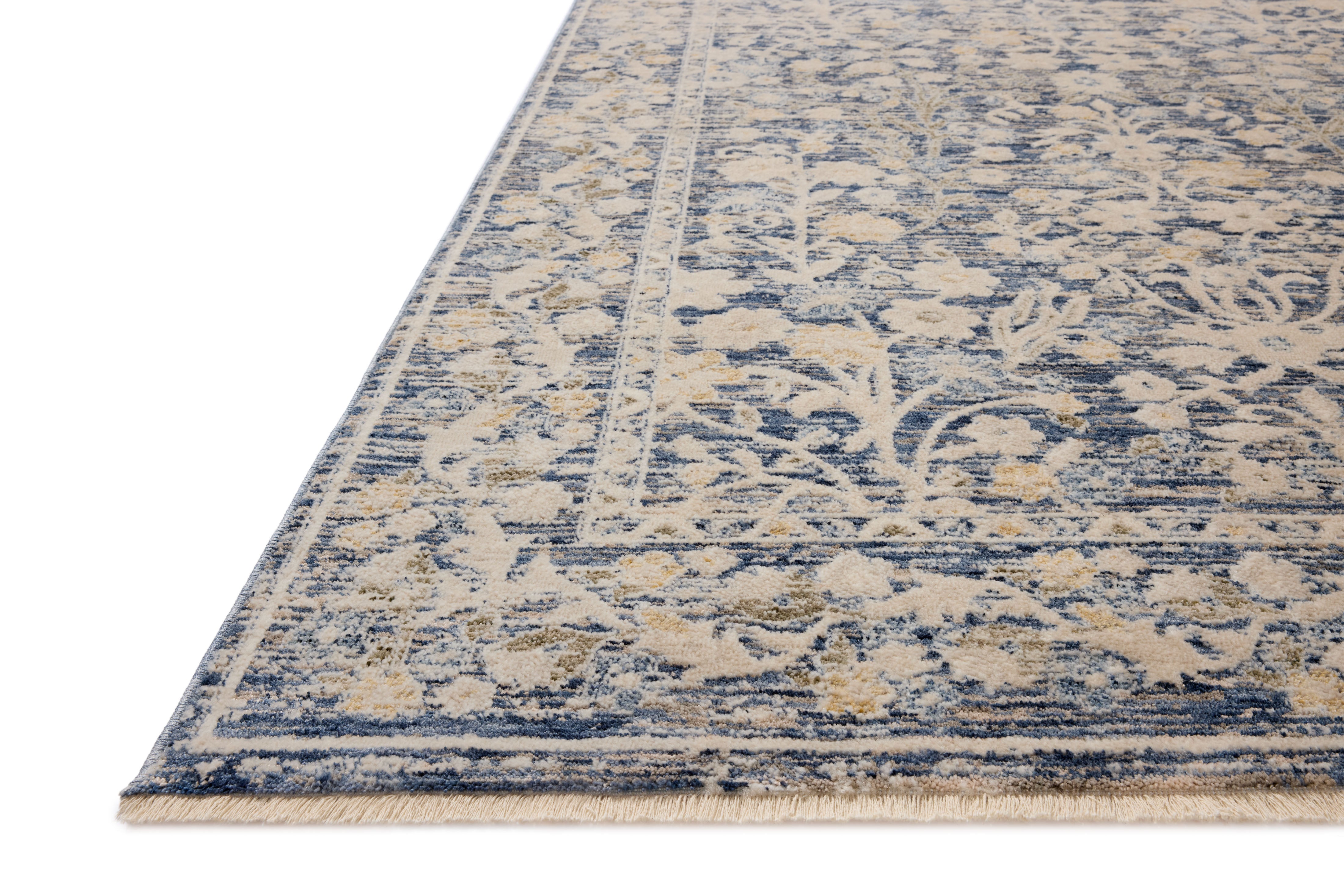 A power-loomed polyester area rug with traditional and floral design in calming blue and warm beige hues, the Clarisse CLS-05 Blue / Beige Area Rug is a standout in any décor