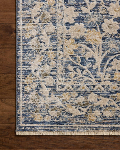 A power-loomed polyester area rug with traditional and floral design in calming blue and warm beige hues, the Clarisse CLS-05 Blue / Beige Area Rug is a standout in any décor