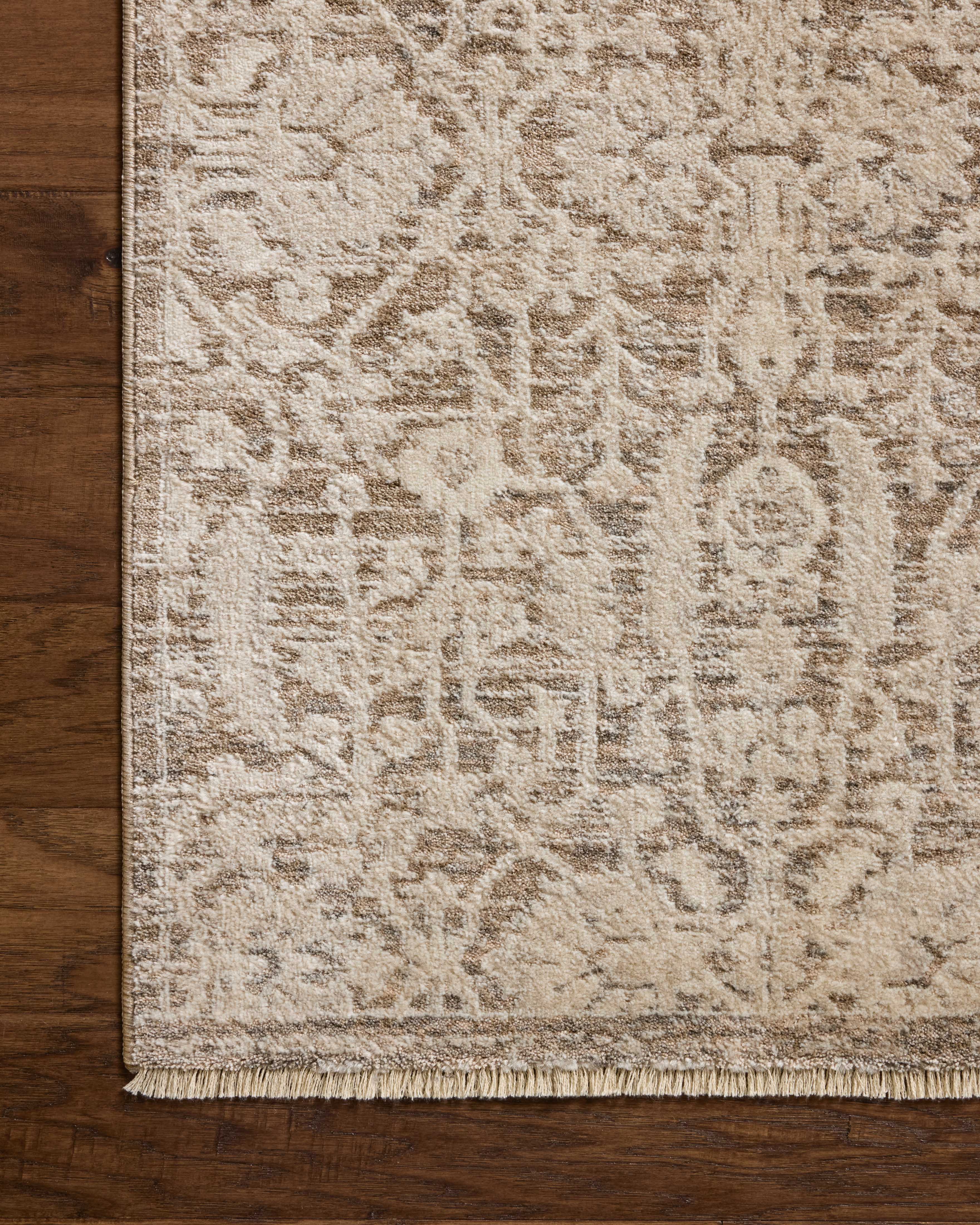 Dressed in misty and bone hues with traditional and floral detail, the Clarisse CLS-06 Fog / Bone Area Rug is a power-loomed polyester area rug that completes any room